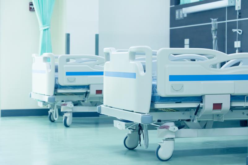 Clean empty bed in a hospital ,Patient bed in hospital,Empty hospital bed