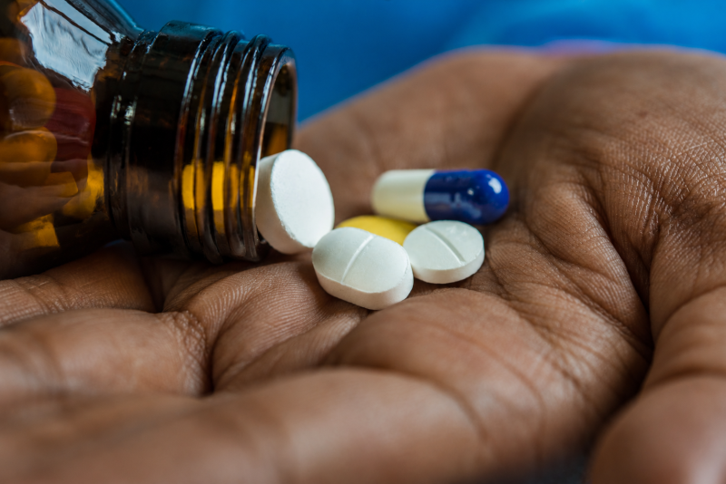 medicine spilled in cupped hand