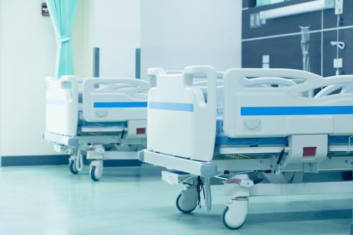 Clean empty bed in a hospital ,Patient bed in hospital,Empty hospital bed